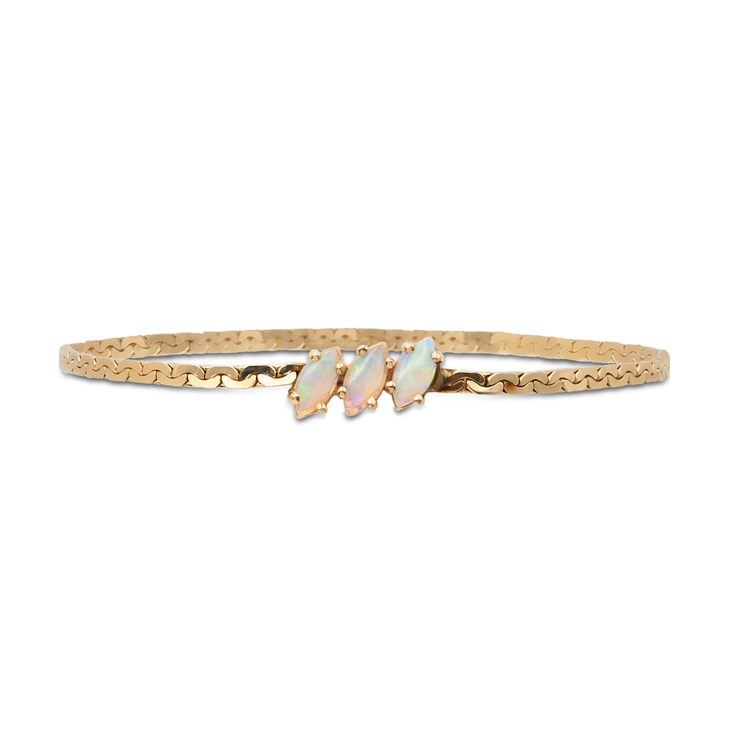 A vintage 14 karat yellow gold flat link bracelet with 3 marquise Australian opals (Front).