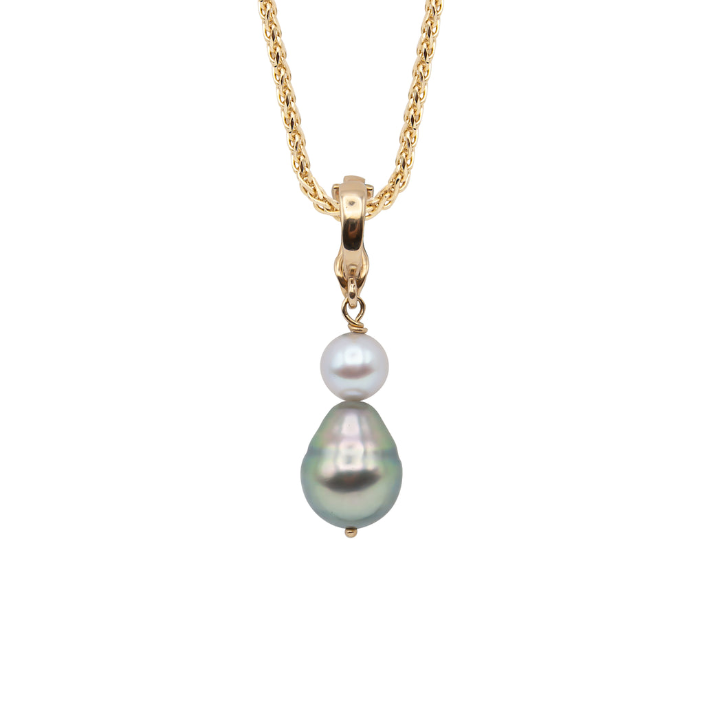 A 14 karat yellow gold pendant with a spherical gray Akoya pearl and pear shaped Tahitian pearl (on chain).