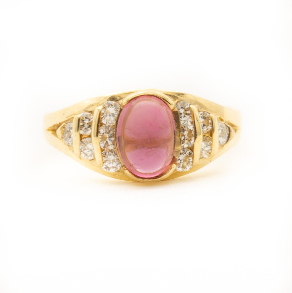 Pink Tourmaline flanked by Brilliant Cut Diamonds