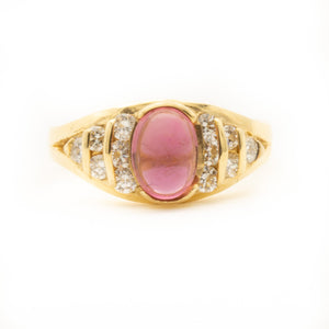 Pink Tourmaline flanked by Brilliant Cut Diamonds