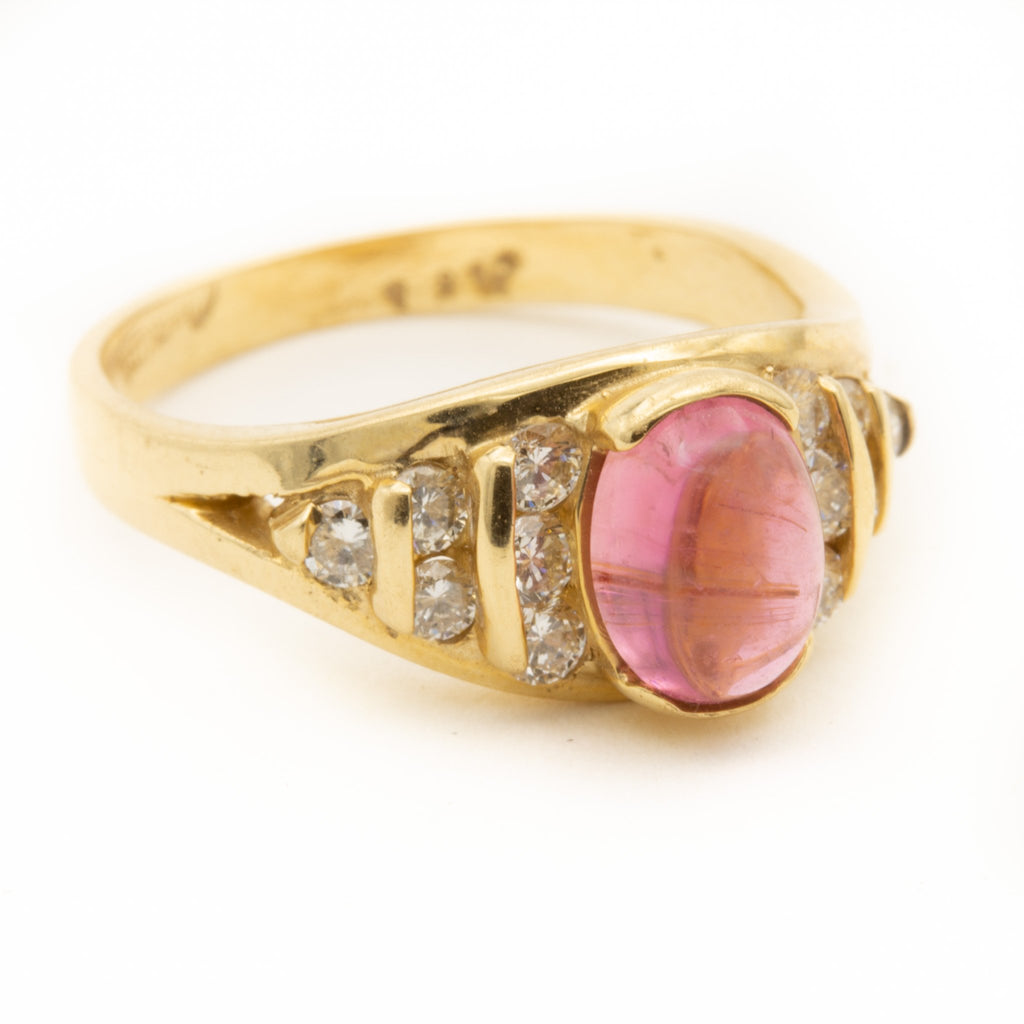 Pink Tourmaline flanked by Brilliant Cut Diamonds