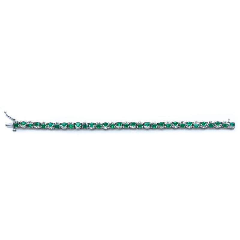14 Karat White Gold Bracelet Prong Set with Fine Quality Natural Emeralds and Diamonds Weighing Totally 791/100 Carats Bracelet.
